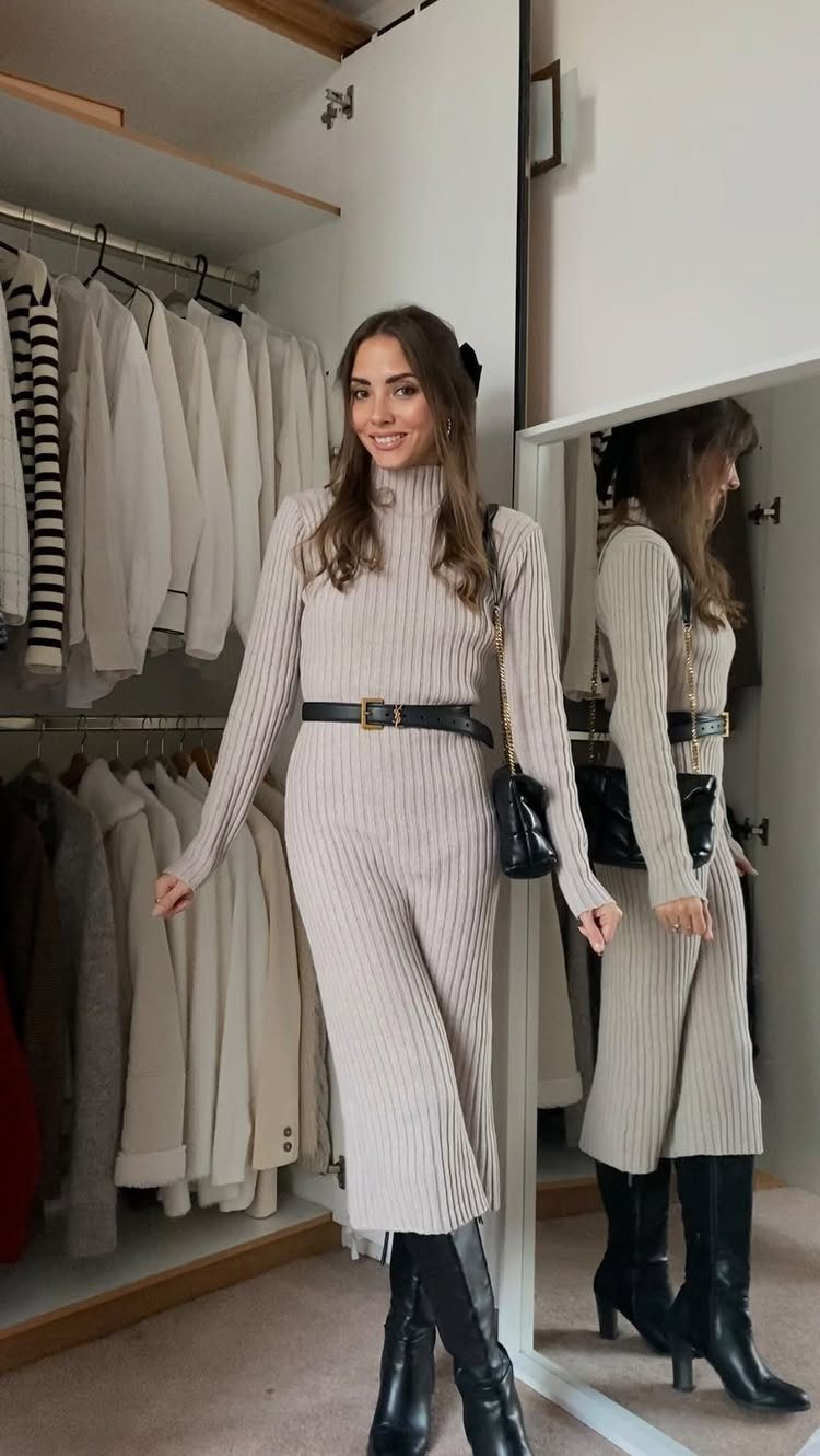 26 Classy Date Outfits From Casual to Elegant 11 Woman wearing a ribbed beige sweater dress with a black belt and boots.