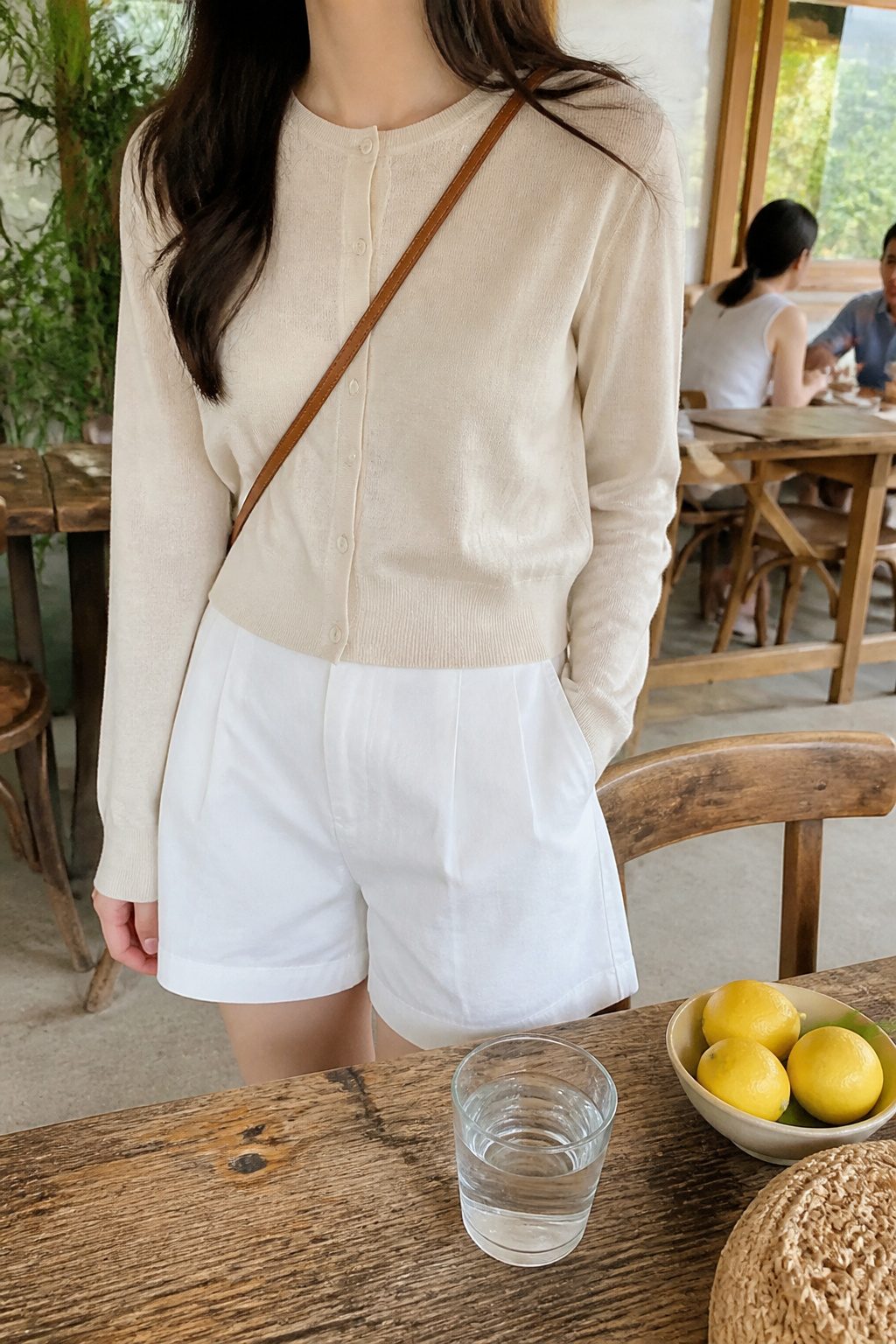How to Style White Shorts: 6 Outfit Ideas for Any Occasion 5 A lightweight cardigan styled with white shorts.