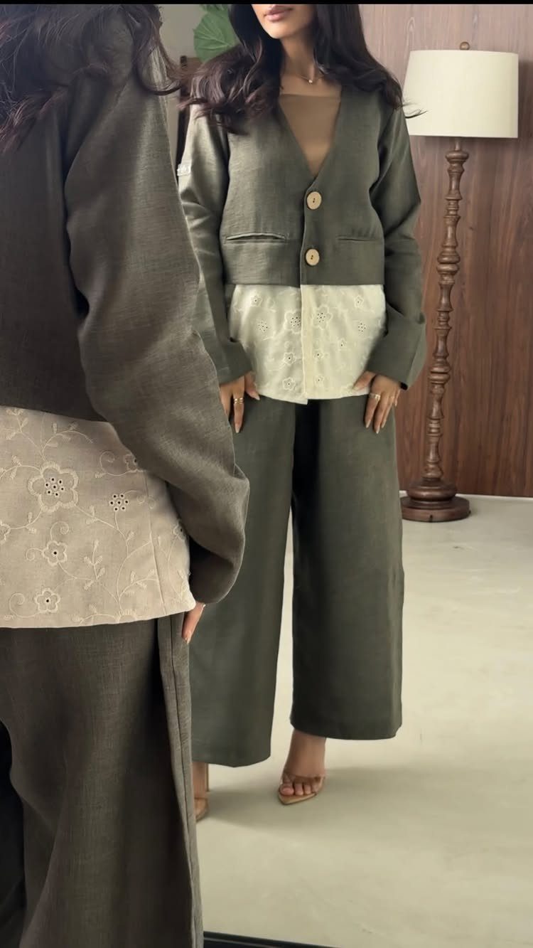 Linen Fashion Women: 6 Outfit Upgrades for 2026 2 Woman wearing an olive green linen jacket with lace detailing and matching wide-leg linen pants.