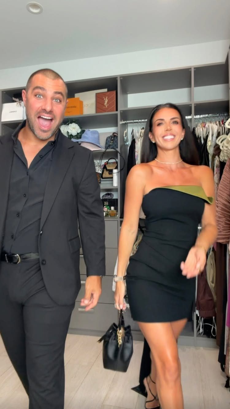 10 Outfit Ideas for Mom: From Classic Days to Mom's Nights Out 2 Woman in a black strapless dress and man in a black suit smiling in a walk-in closet.