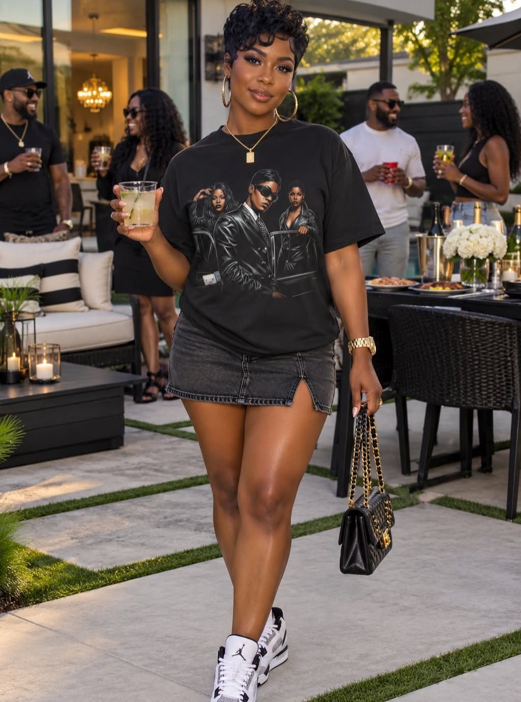 Woman in black graphic tee and denim mini skirt posing in an outdoor patio.