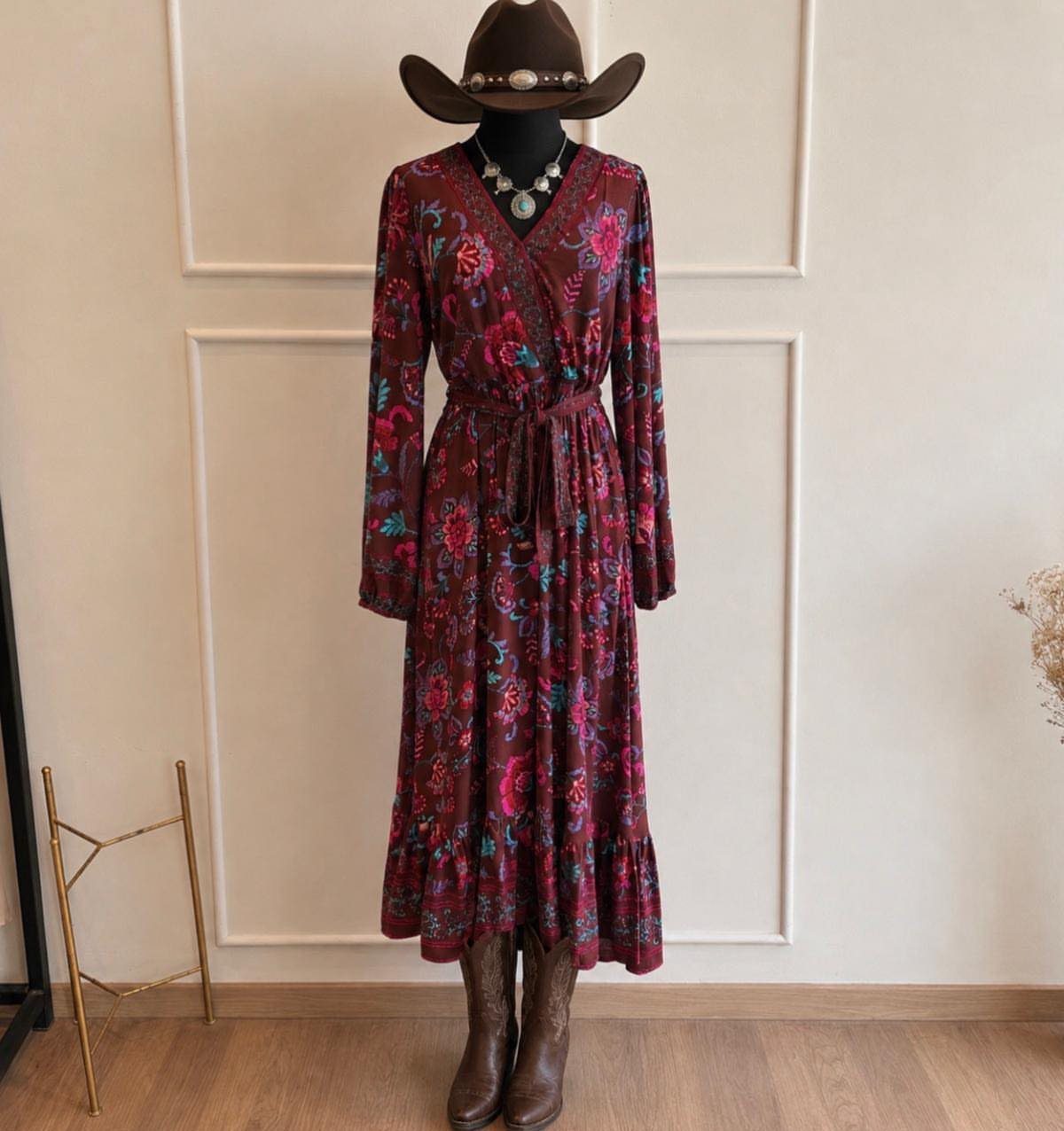 Outfit with Cowboy Boots: 6 Ways From Casual to Dressy 4 Maroon floral maxi dress paired with brown cowboy boots and a matching hat.