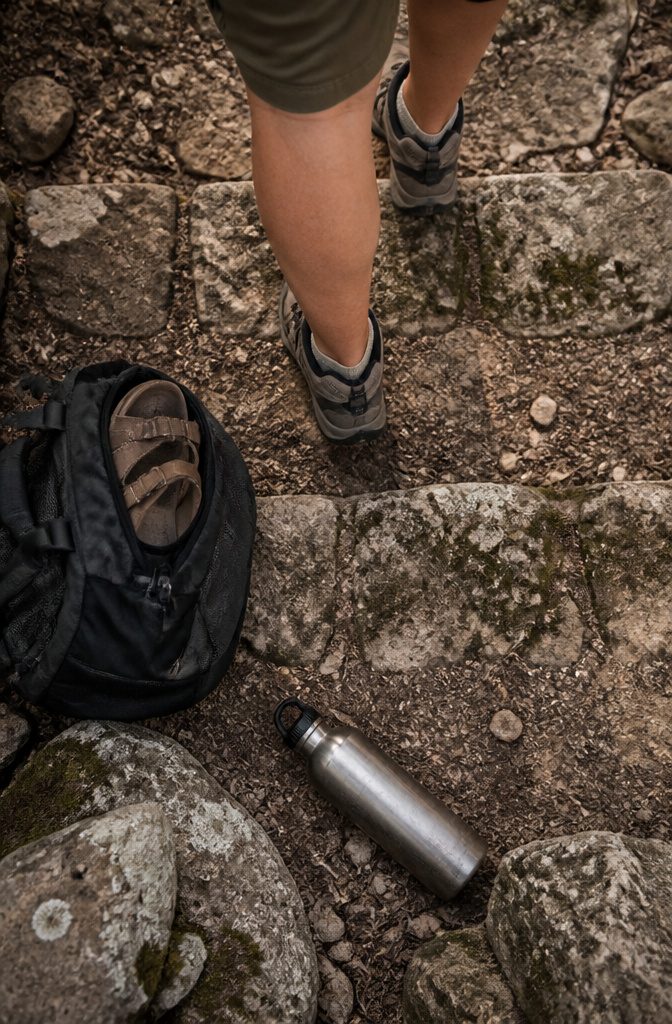 Walking shoes beside a flat sandal for city streets and excursions