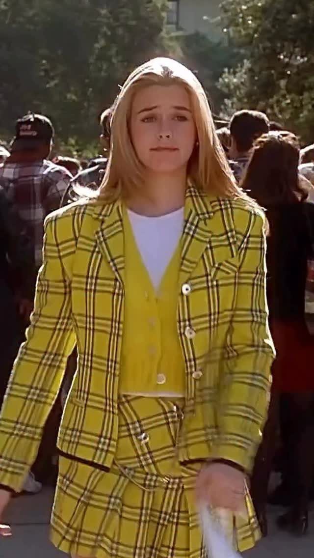 11 Outfits for Teens: Street to Semiformal Style Ideas 7 Blonde woman walking outdoors wearing a bright yellow plaid blazer and matching skirt set.