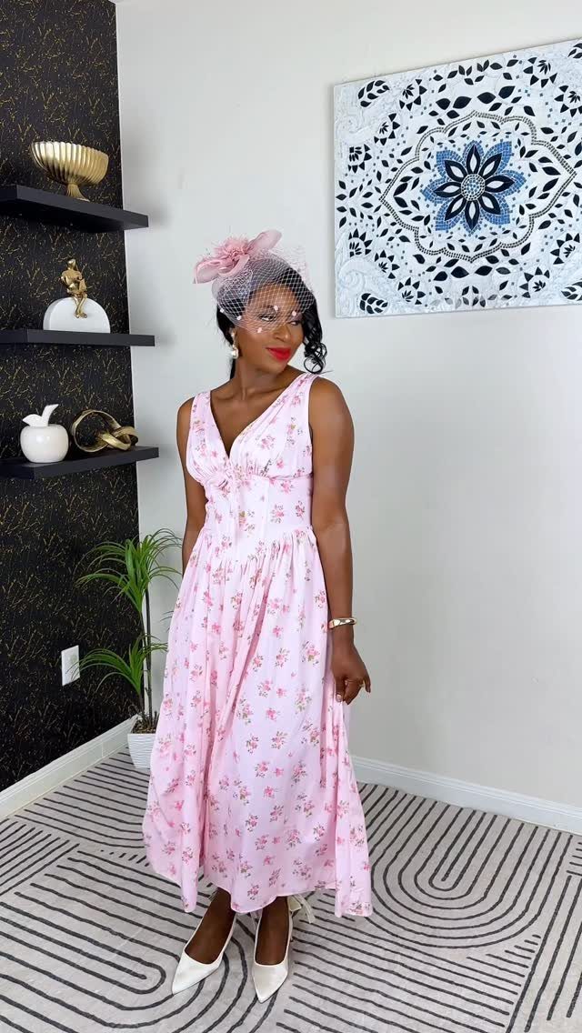 Tea Party Dresses: 6 Outfit Ideas for Brunches and Garden Events 1 A woman posing in a pink floral midi dress and a matching pink fascinator hat.