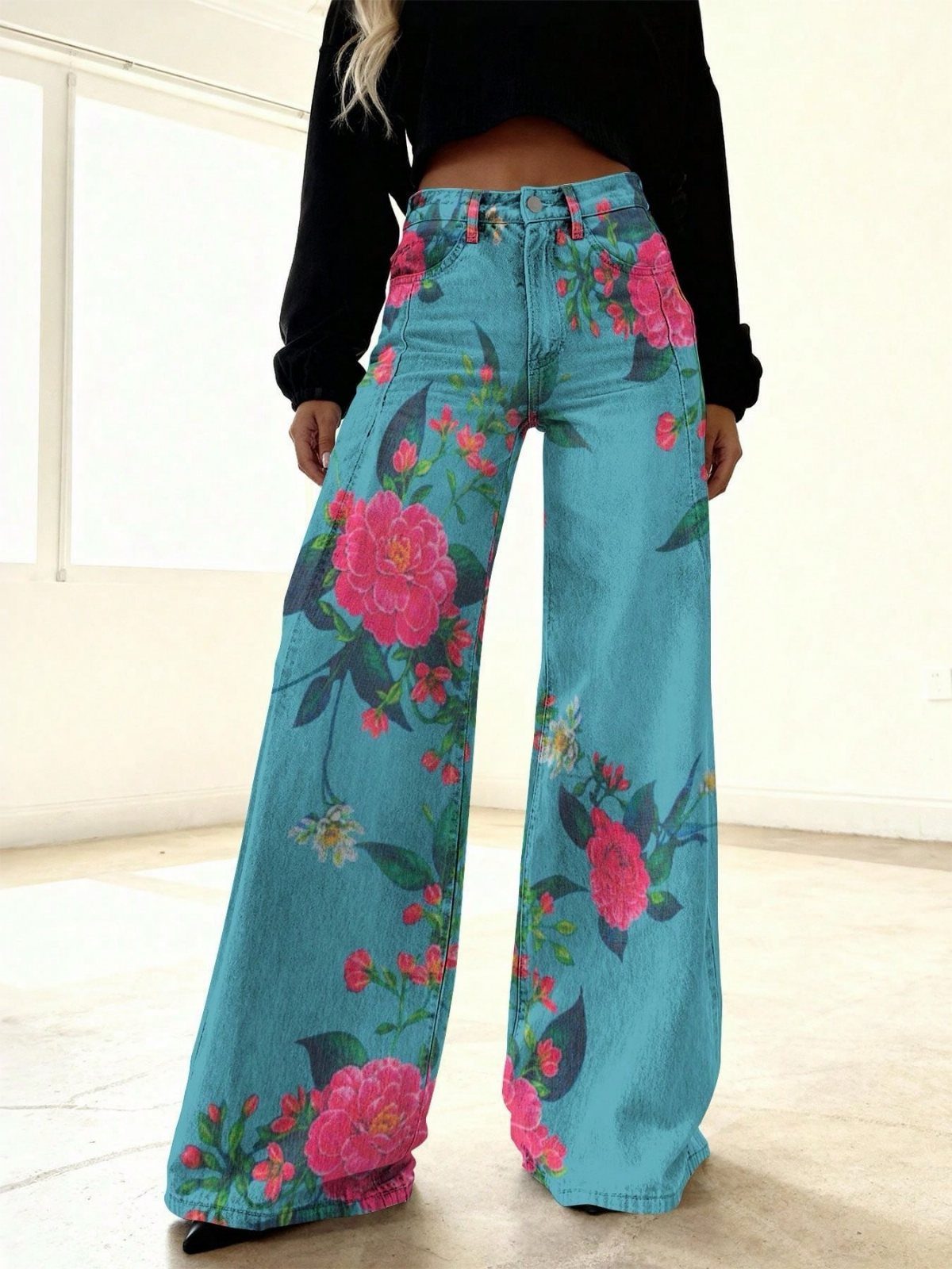 12 Wide Leg Pants Outfit Ideas, From Casual to Polished 10 Wide-leg blue denim pants with pink floral prints and a black cropped top.