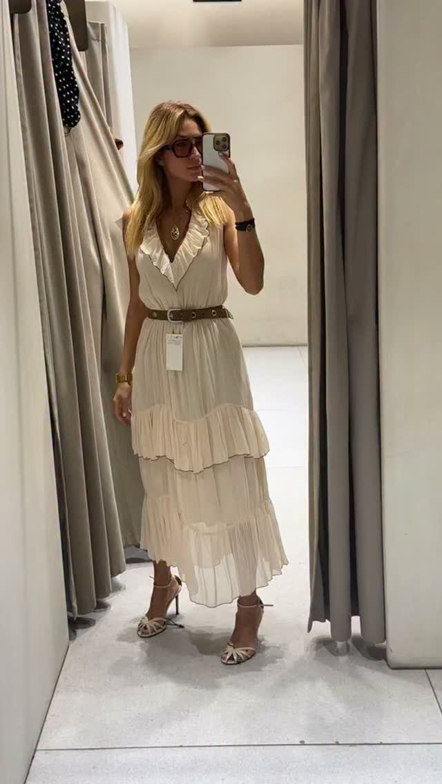 Zara Summer Dresses From Mini to Maxi (21 Characters) 1 Woman in a cream tiered maxi dress with a brown belt in a dressing room.